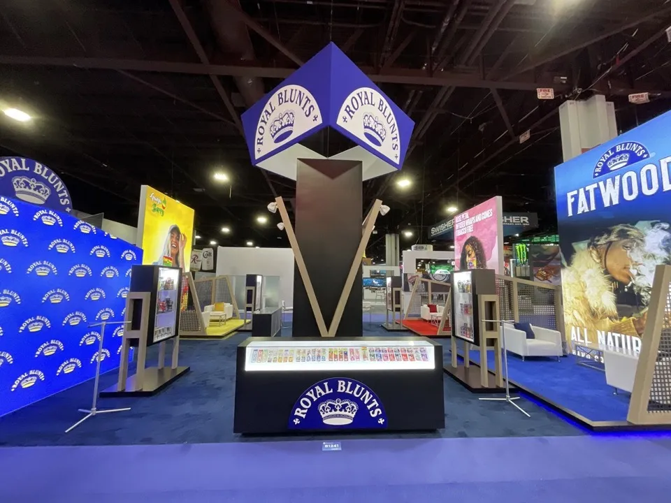 Royal Blunts exhibit with a central illuminated tower and product displays