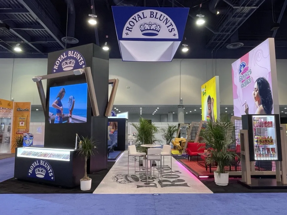 Royal Blunts exhibit with a central illuminated tower and product displays