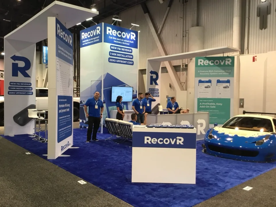 RecovR exhibit with illuminated blue architecture on the show floor