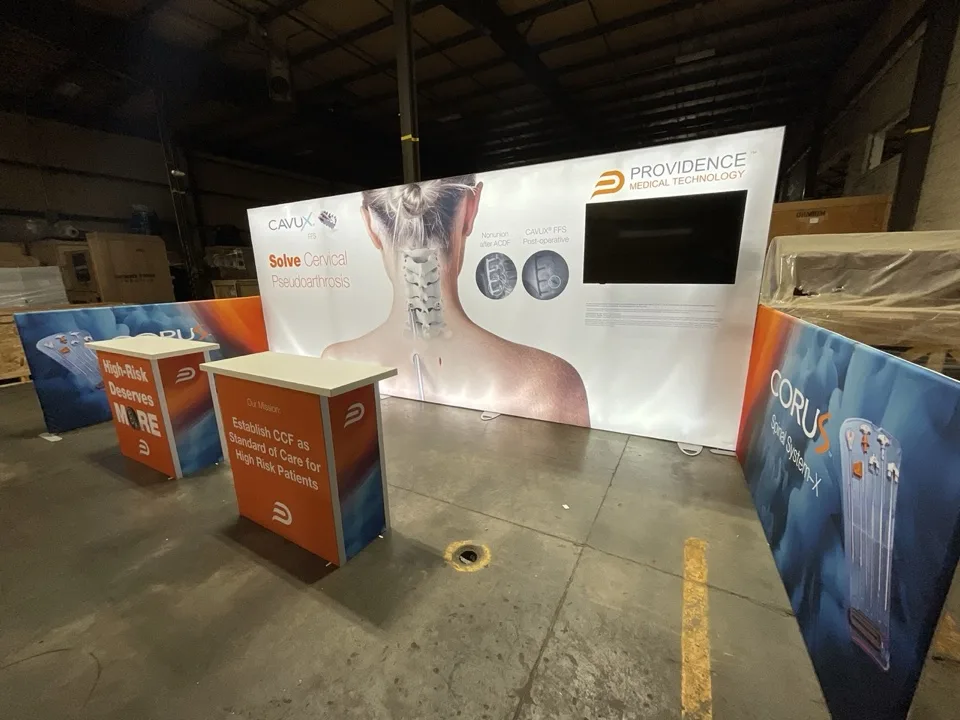 Branded exhibit components arranged for inspection on the fabrication floor