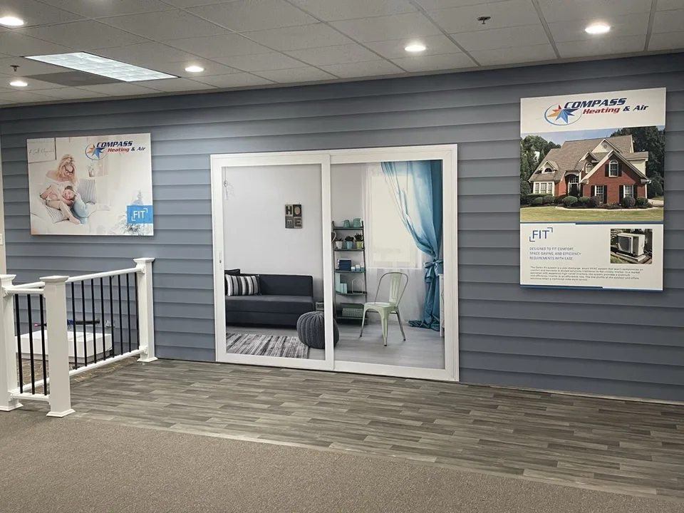 Finished exhibit with house-inspired architecture and a branded entrance